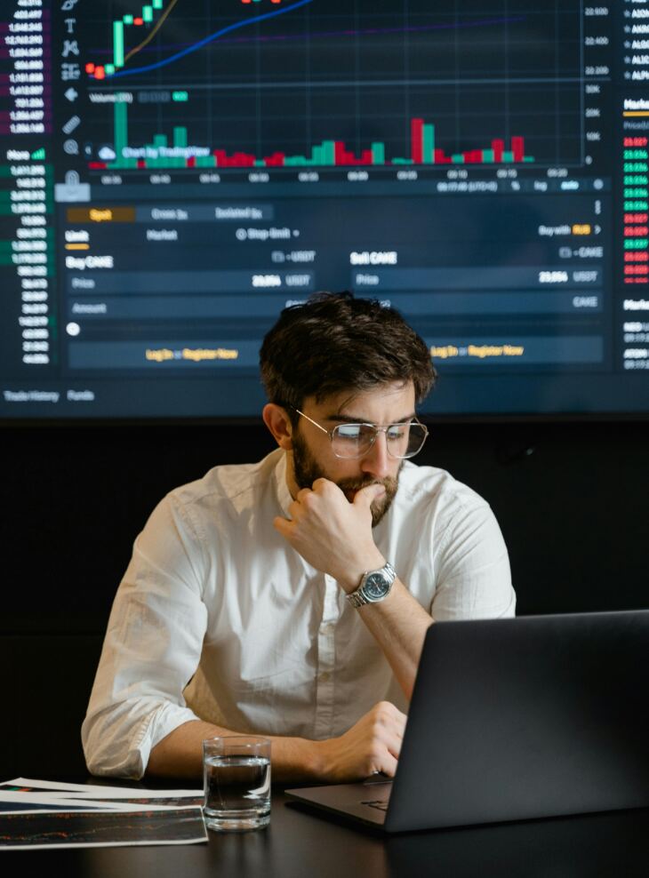Business broker reviewing market data and opportunities