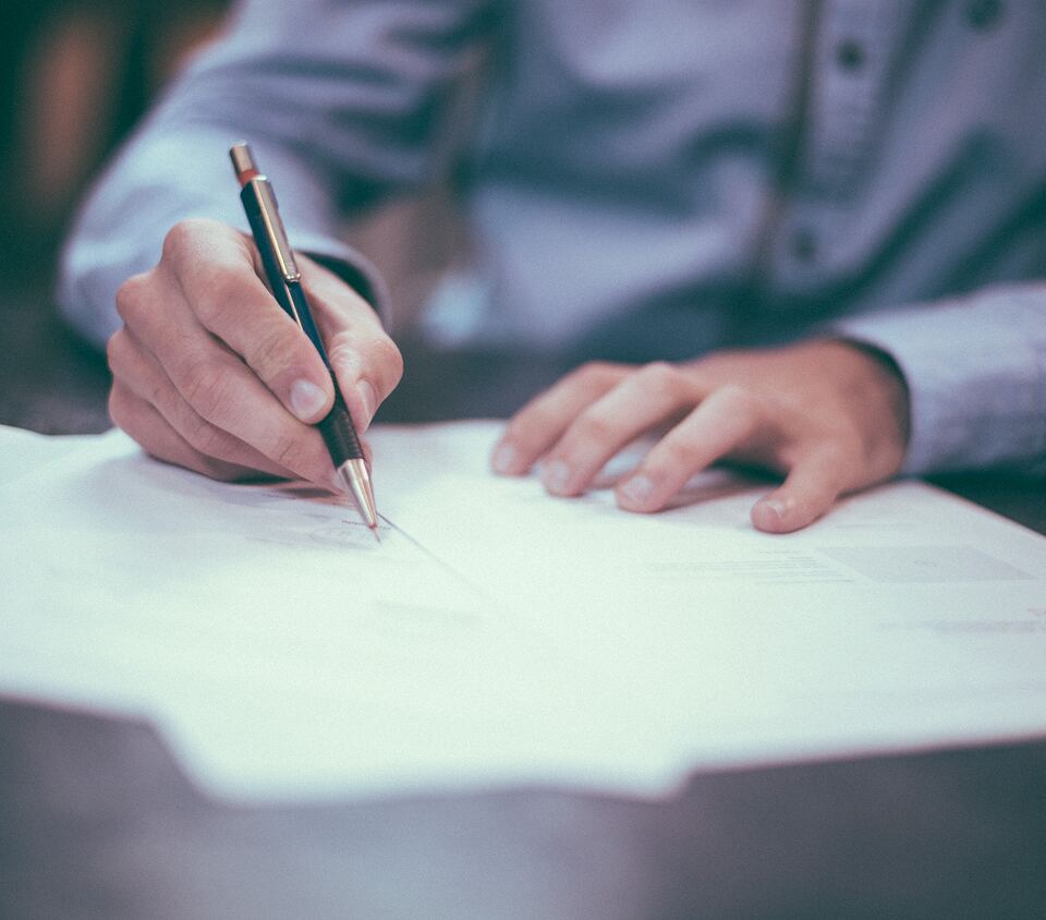 M&A advisor reviewing transaction documents